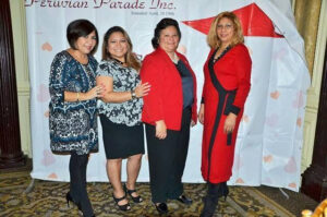 Four women from Team Peru Square, including Patricia Quispe, Cristina Tone, Nelly Celi, and Maria del Carmen Salinas, standing together at a Peruvian Parade Inc. event.
