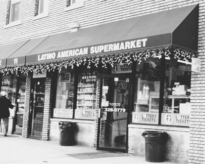 FIGURE 5-2. Puerto Rican Business: The Latino American Supermarket, Dover, 2003. This bodega, originally called the Spanish-American Grocery Store, was opened in 1957. Throughout the Puerto Rican diaspora, bodegas sold familiar products, provided an opportunity for entrepreneurship, and offered a locale for social interactions and networking. Bodegas also played an important financial role in communities, sometimes letting people buy on credit, and in Dover, doubling as a savings bank of sorts. (Courtesy of Olga Jimenez de Wagenheim.)